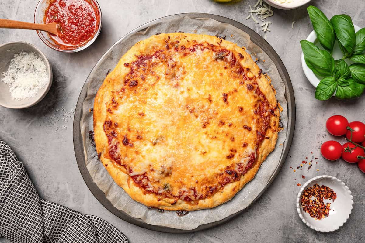 Golden-baked cottage cheese pizza crust topped with melted cheese.