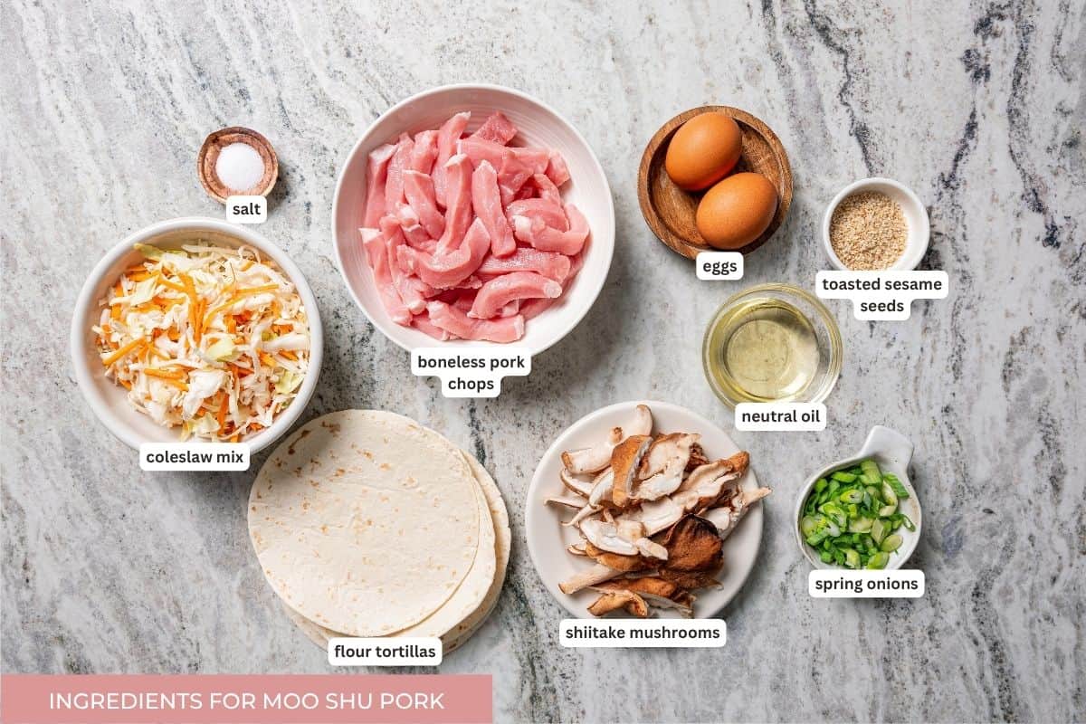 Craving moo shu pork for dinner? This homemade copycat is better than takeout and ready in 25 minutes with pork, veggies, and savory sauce. Labeled moo shu pork ingredients.