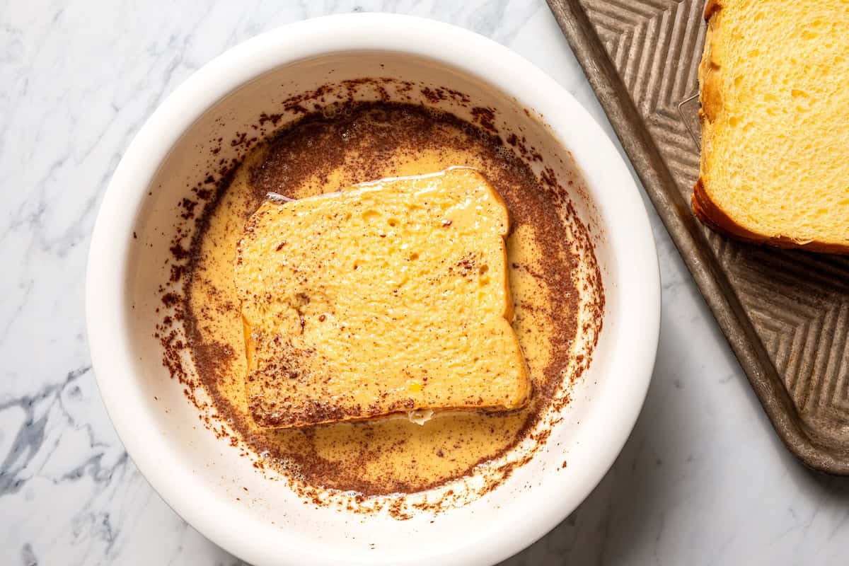Make this cream cheese stuffed French toast with thick slices of custard-dipped brioche filled with sweet mascarpone and fresh lemon zest. Stuffed French toast soaking in a bowl of egg custard with cinnamon.