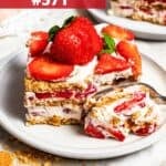 A slice of a layered strawberry icebox cake.