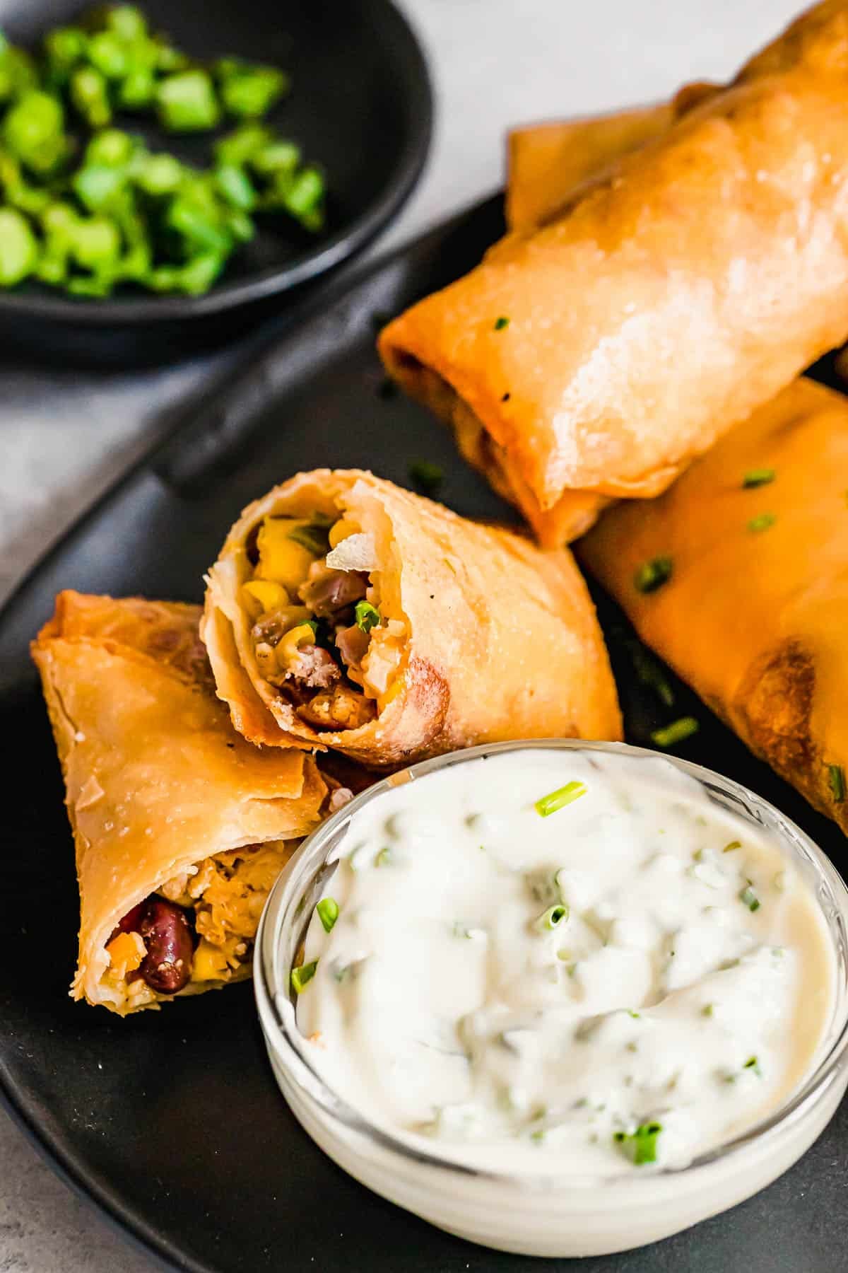 Weekly Meal Plan Homemade egg rolls served on a plate.