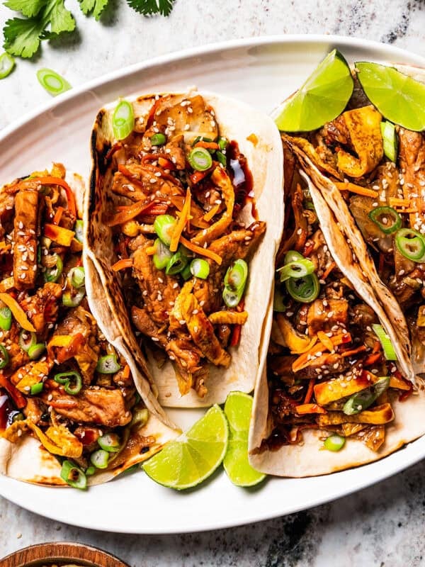 Moo shu pork wraps served on a platter.