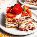 A fork cutting into a slice of icebox cake.