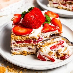 A fork cutting into a slice of icebox cake.