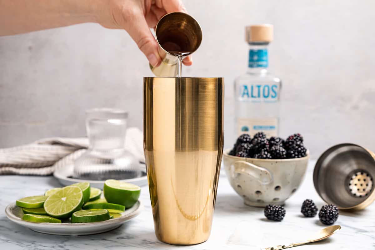 A blackberry margarita puts a refreshing, sweet-tart spin on the classic cocktail, with fresh muddled blackberries, tequila blanco, and lime. Adding a shot of simple syrup to the cocktail shaker.