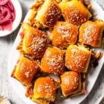 BBQ pulled pork sliders served on a platter.