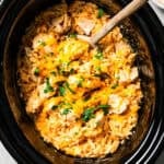 Overhead view of cheesy cream of mushroom chicken and rice in the slow cooker.
