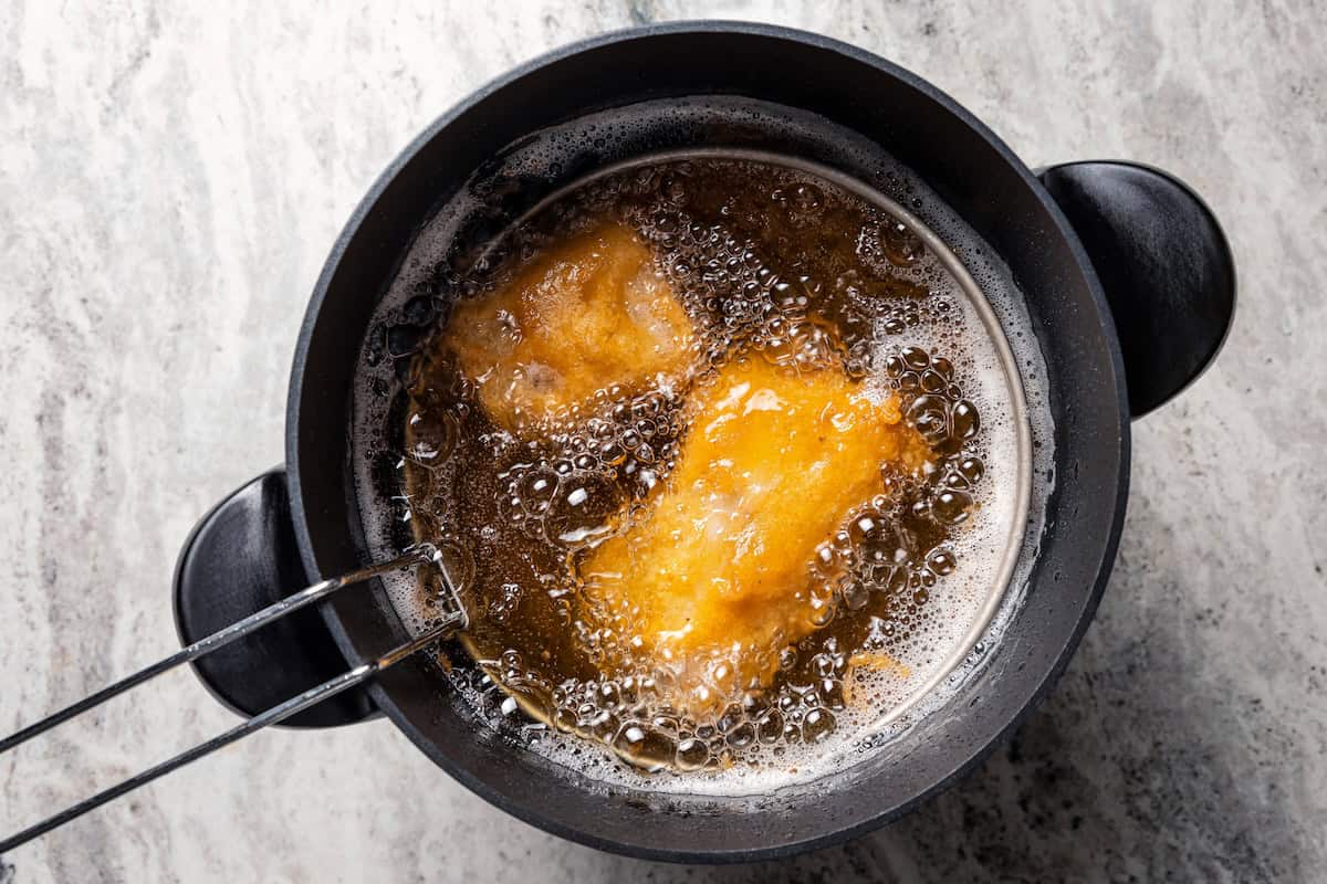 Make beer-battered fish with easy ingredients! This crispy, flaky fried white fish is perfect for tacos, pub-style fish and chips, and more. Beer battered fish in the deep fryer.
