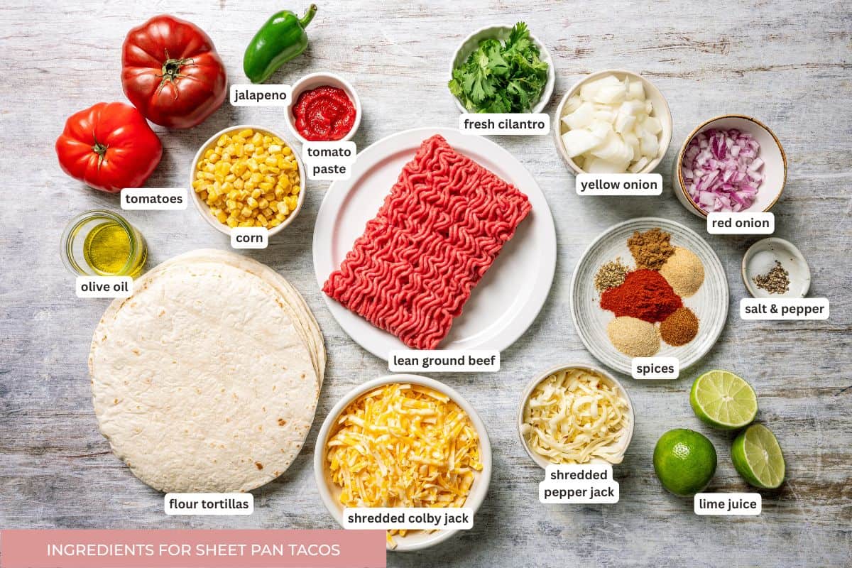 Baked sheet pan tacos are an easy way to make tacos for a crowd with crispy tortillas, seasoned ground beef, melty cheese, and pico de gallo. Sheet pan tacos ingredients with text labels overlaying each ingredient.