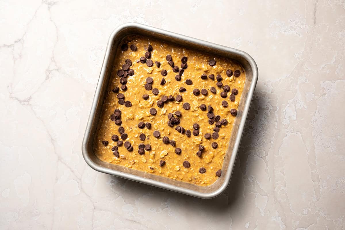 Pumpkin baked oatmeal is the perfect easy, make-ahead fall breakfast! Filled with hearty oats, warm spices, pumpkin purée, and maple syrup. Pumpkin baked oatmeal ready to bake.