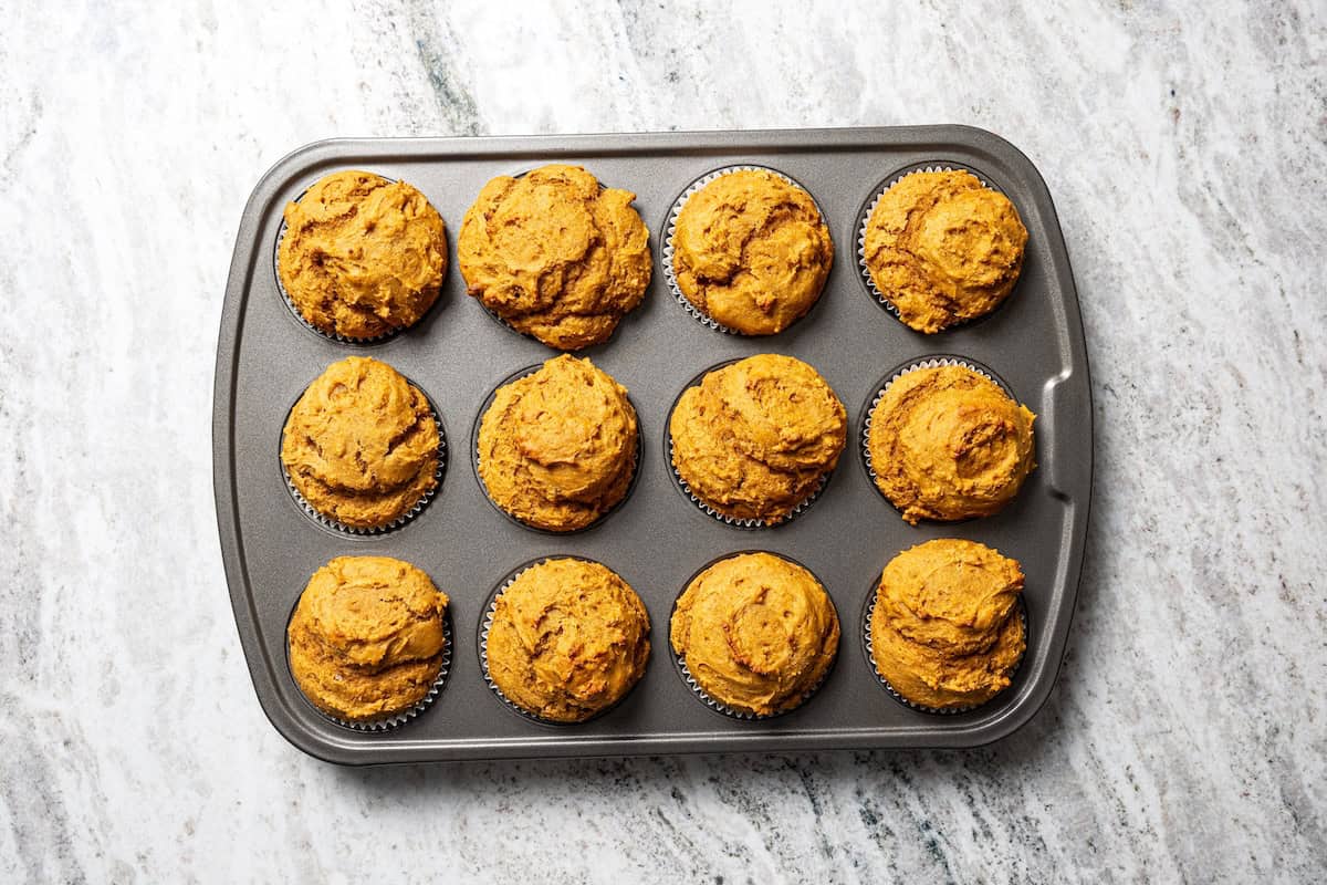 Moist, fluffy pumpkin protein muffins are a high-protein fall treat made with vanilla whey powder, Greek yogurt, eggs, and pumpkin purée. Baked pumpkin protein muffins.