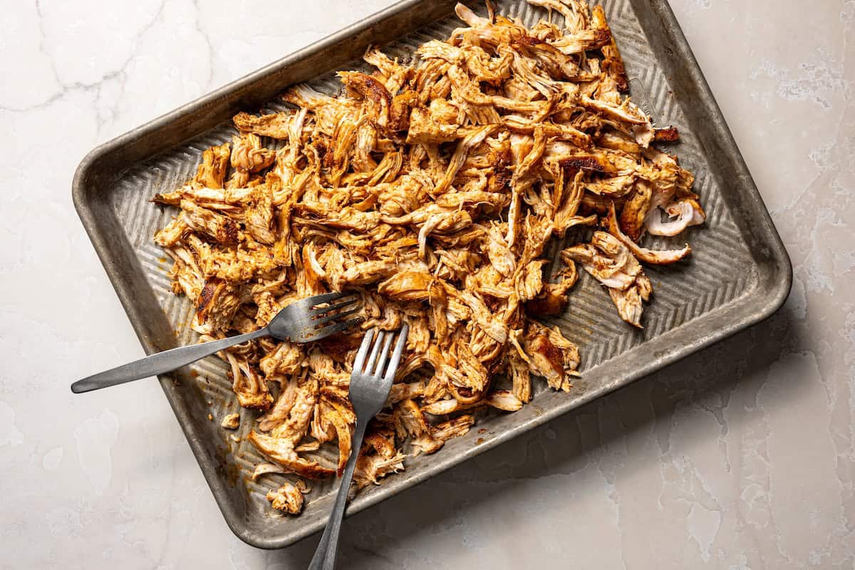 Shredded chicken on a sheet pan.