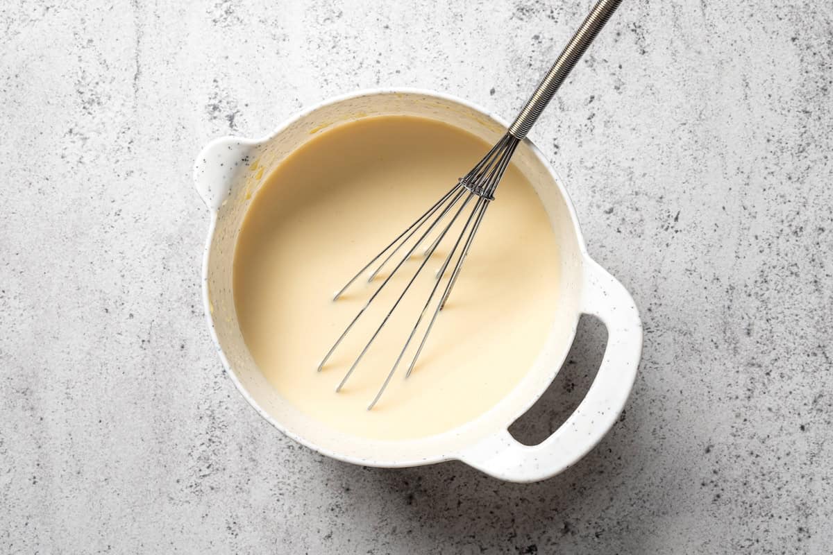 This slow cooker chicken and dumplings recipe is a cozy, creamy chicken stew loaded with homemade biscuit dumplings. All cooked in one pot! Creamy sauce whisked together in a saucepan.