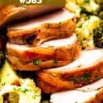 Sliced pork tenderloin set over vegetables.