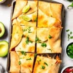 Overhead shot of quesadillas made in a sheet pan.