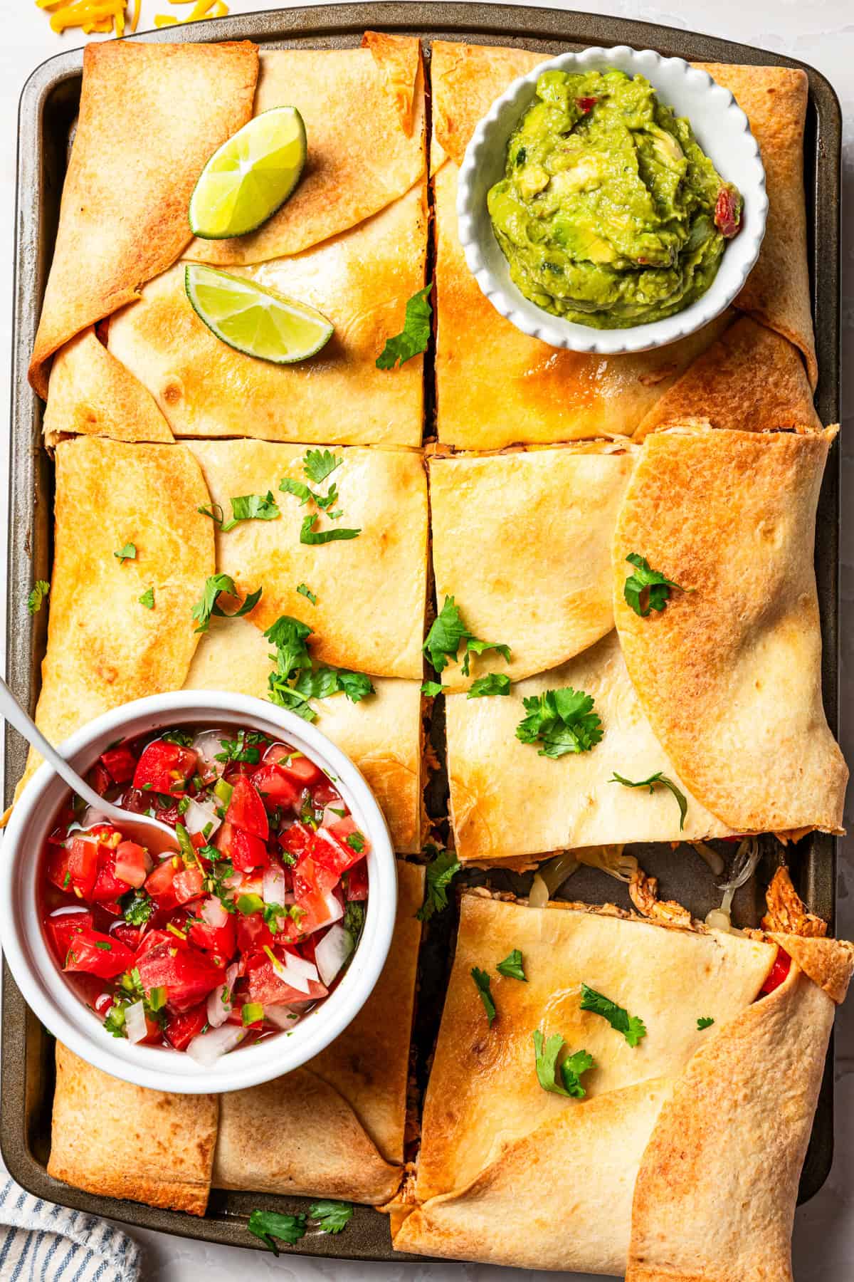Close-up overhead shot of sheet pan quesadillas.