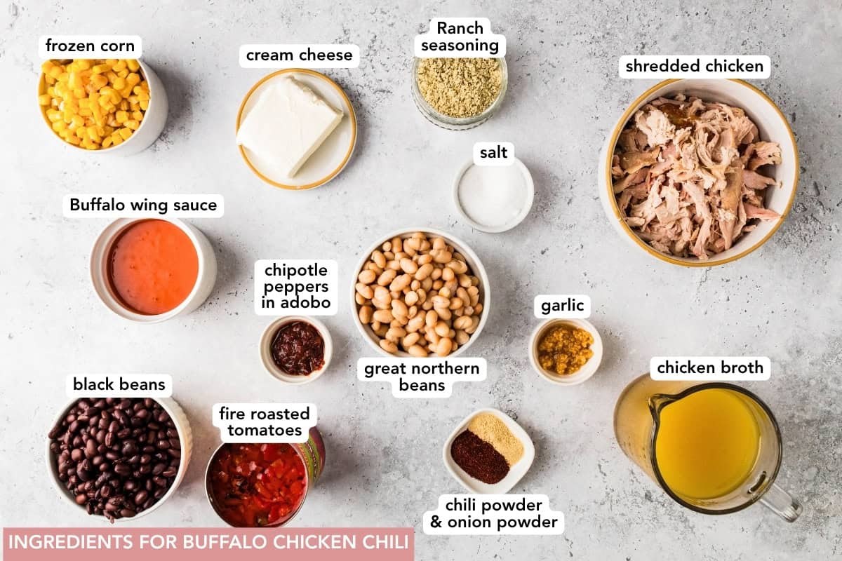 Thick and creamy Buffalo chicken chili made with shredded chicken, beans, Buffalo sauce, and cream cheese. An easy crockpot chili, perfect for weeknights or game day! Ingredients for slow cooker Buffalo chicken chili, including shredded chicken, beans, corn, cream cheese, tomatoes, and Buffalo sauce.