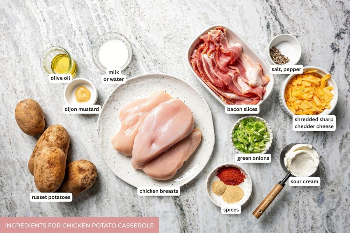 This chicken potato casserole combines juicy seasoned chicken and potatoes, baked in one pan and loaded with bacon, cheese, and sour cream. Chicken potato casserole ingredients with text labels.