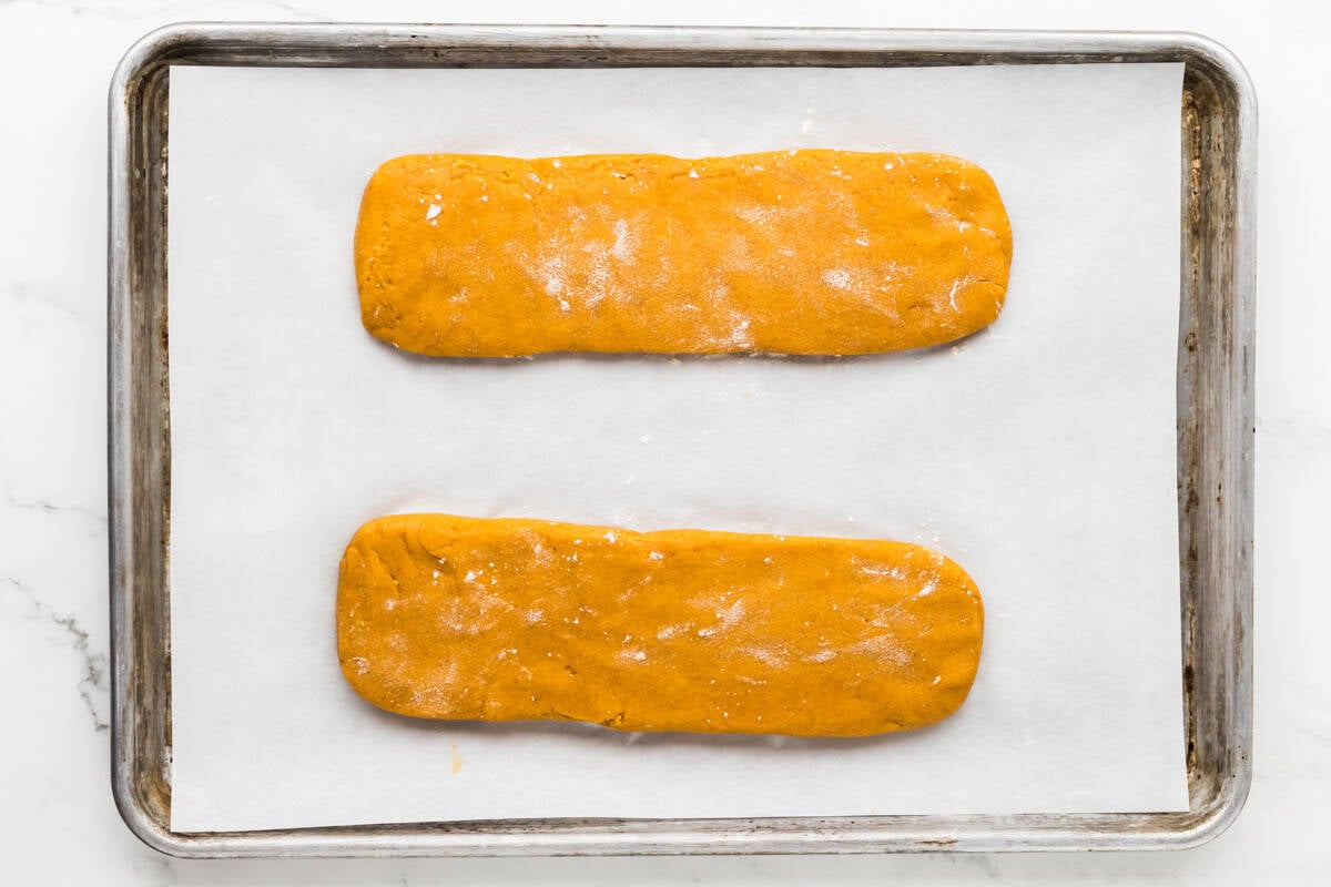 Two biscotti dough logs shaped before baking.